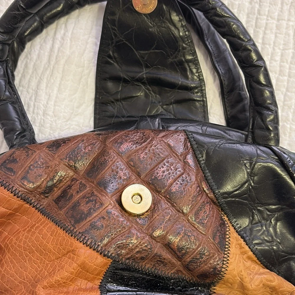 Vintage ‘crazy patchwork’ leather purse with top handles.